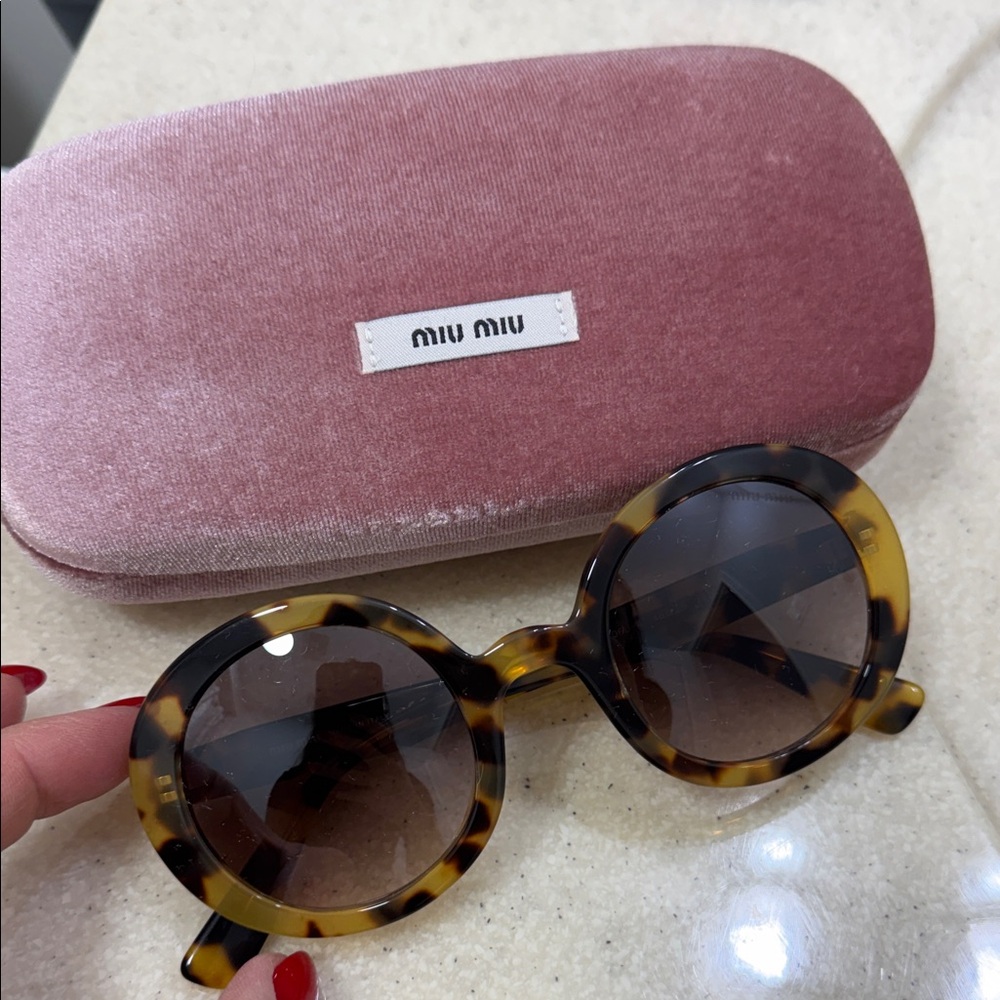 Miu Miu Tortoiseshell Sunglasses with Round Lenses